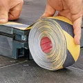 Következő termékkép Csúszásgátló biztonsági szalag Anti-Slip 60951, fekete-sárga, 50 mm x 15 m, TESA
